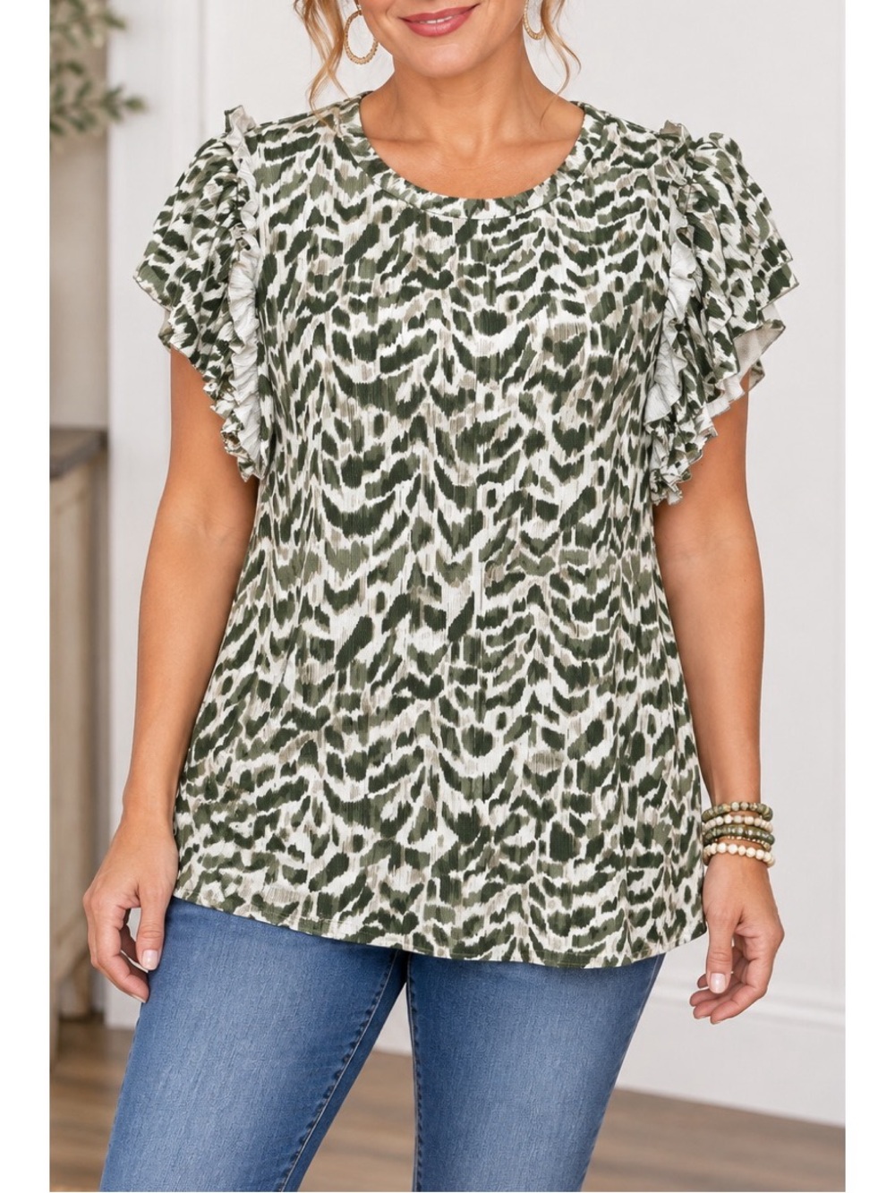 DR2 olive green and cream animal-print blouse with a rounded neckline